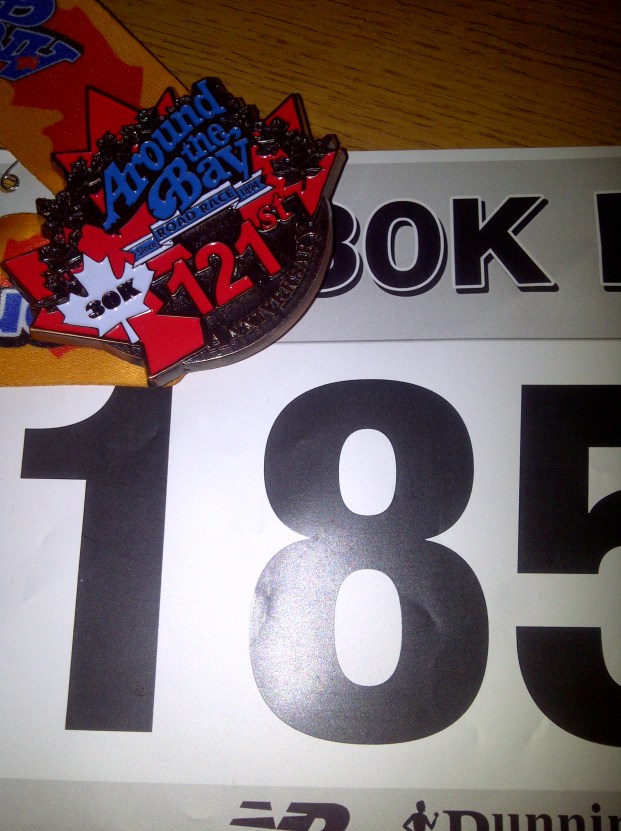 Finisher medal and running bib.