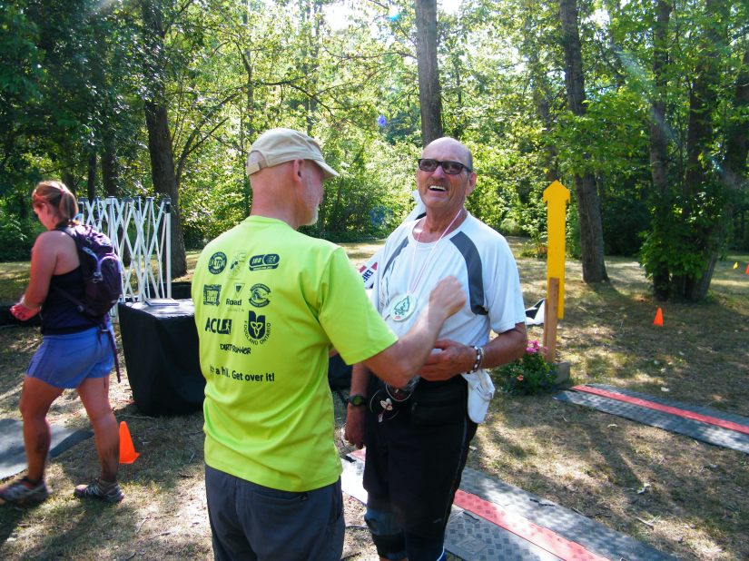 LOVE this photo. "A picture says a thousand words". That smile says it all as Jess receives his finishers medal! :)