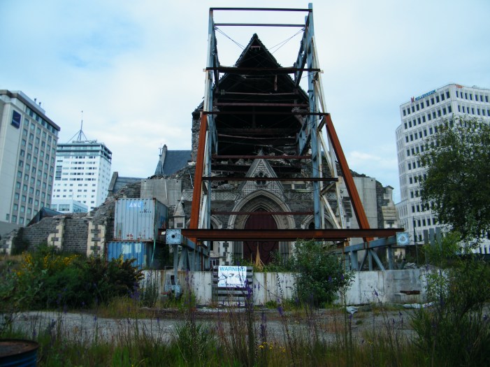 Reinforced with steel girders the left of the picture is where the bell tower used to be. The inside of the church is open to the elements. Was able to get the lens of my camera through the security fence to take the picture.