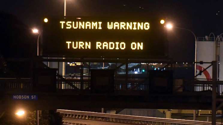 Motorway sign warning of Tsunami, in Wellington, Monday, Nov. 14, 2016, after a major earthquake struck New Zealand's south Island early Monday. A powerful earthquake struck in a mostly rural area close to the city of Christchurch but appeared to be more strongly felt in the capital, Wellington, more than 200 Km (120 miles) away. (Ross Setford/SNPA via AP)
